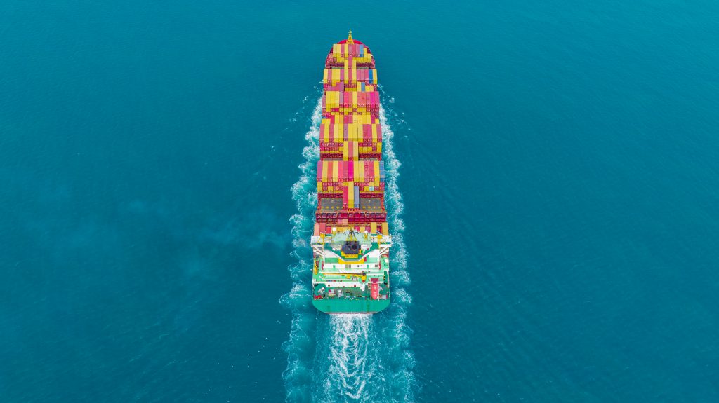 Cargo container Ship, cargo maritime ship with contrail in the o